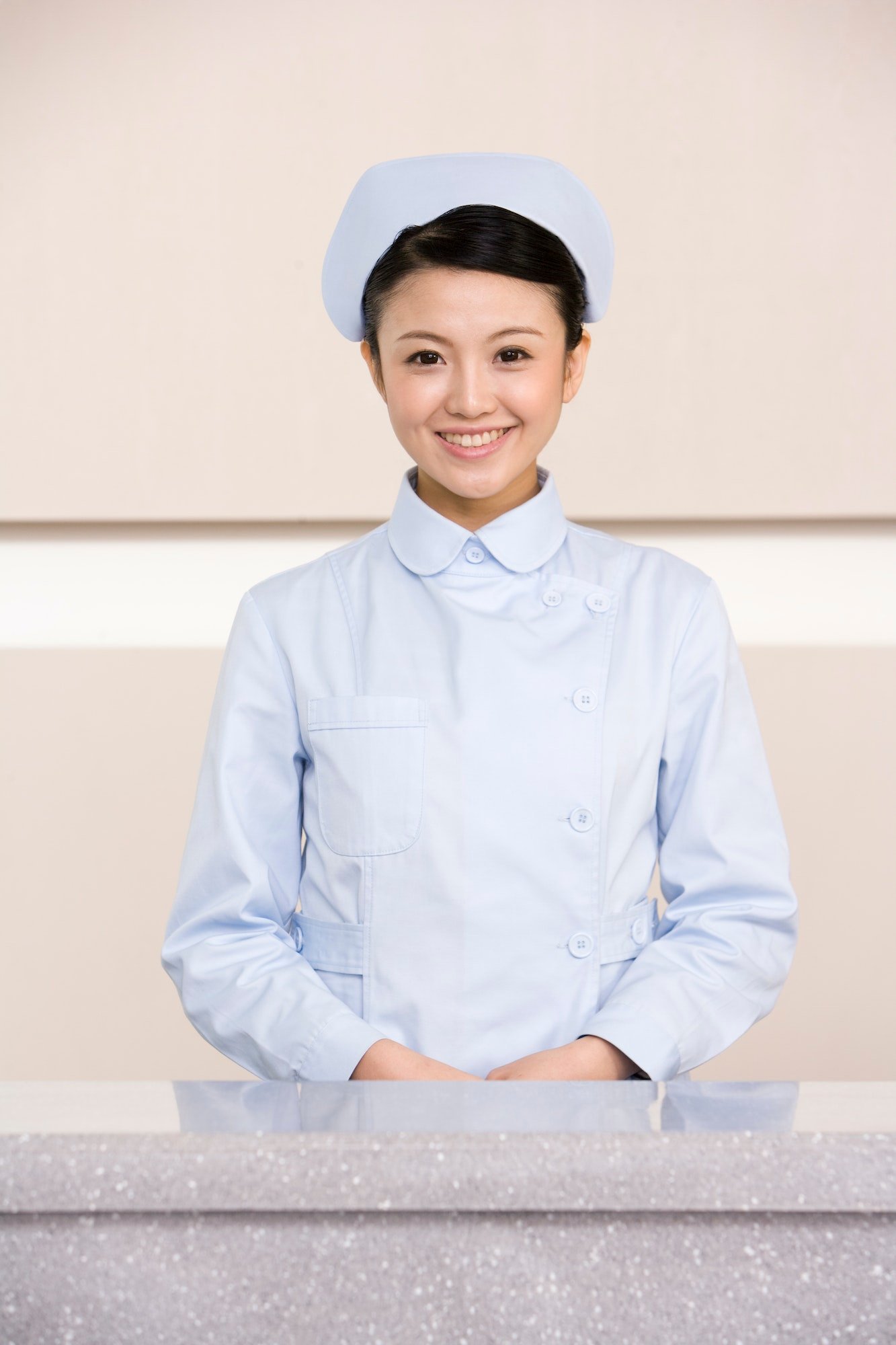 young-nurse-poised-at-nurses-station.jpg